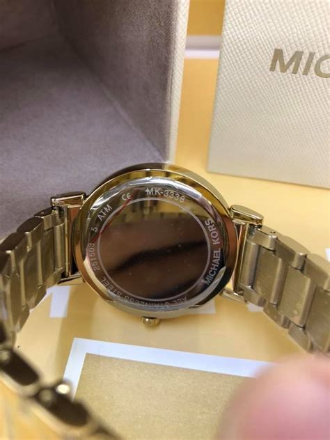 check michael kors watch serial number|Michael Kors Watch authenticity.